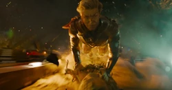 Adam flying while trapping Groot