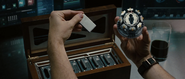 Stark preparing to insert a fresh palladium core into his arc reactor.