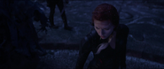 Black Widow looks at cliff