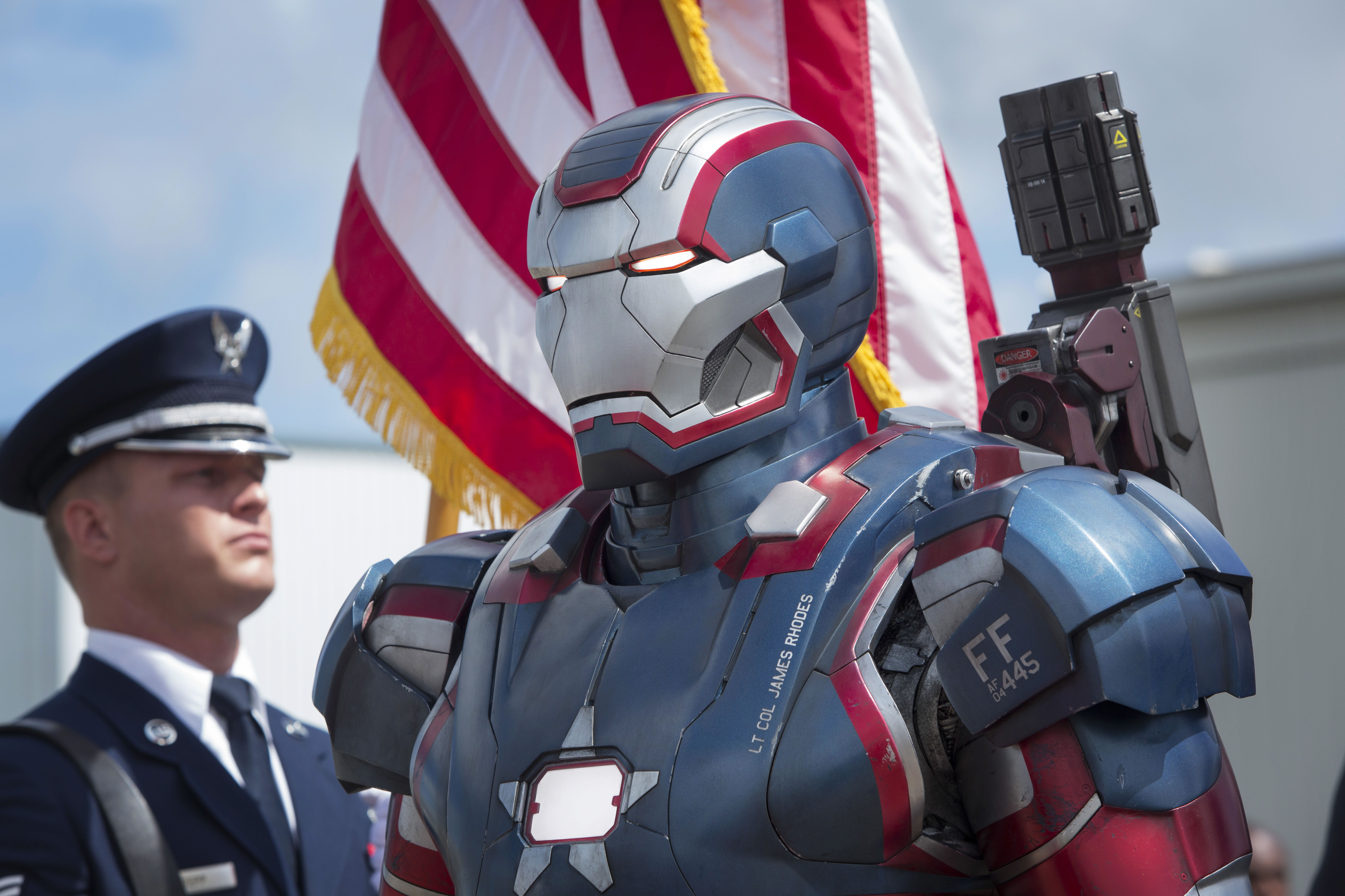 In Iron Man 2 War Machine has ED 445 FLTS on his shoulder. This is the  tail code for the 445th Flight Test Squadron out of Edwards Air Force Base,  which is