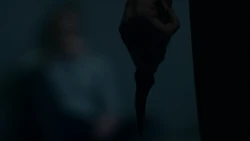  holding the  in front of 