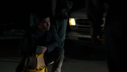 Todd counting the money that they stole