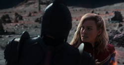 Captain Marvel interrogates a  soldier