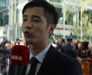 Kim Scar as Chinese Newscaster