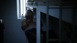 Noguera reading his book while inside his cell