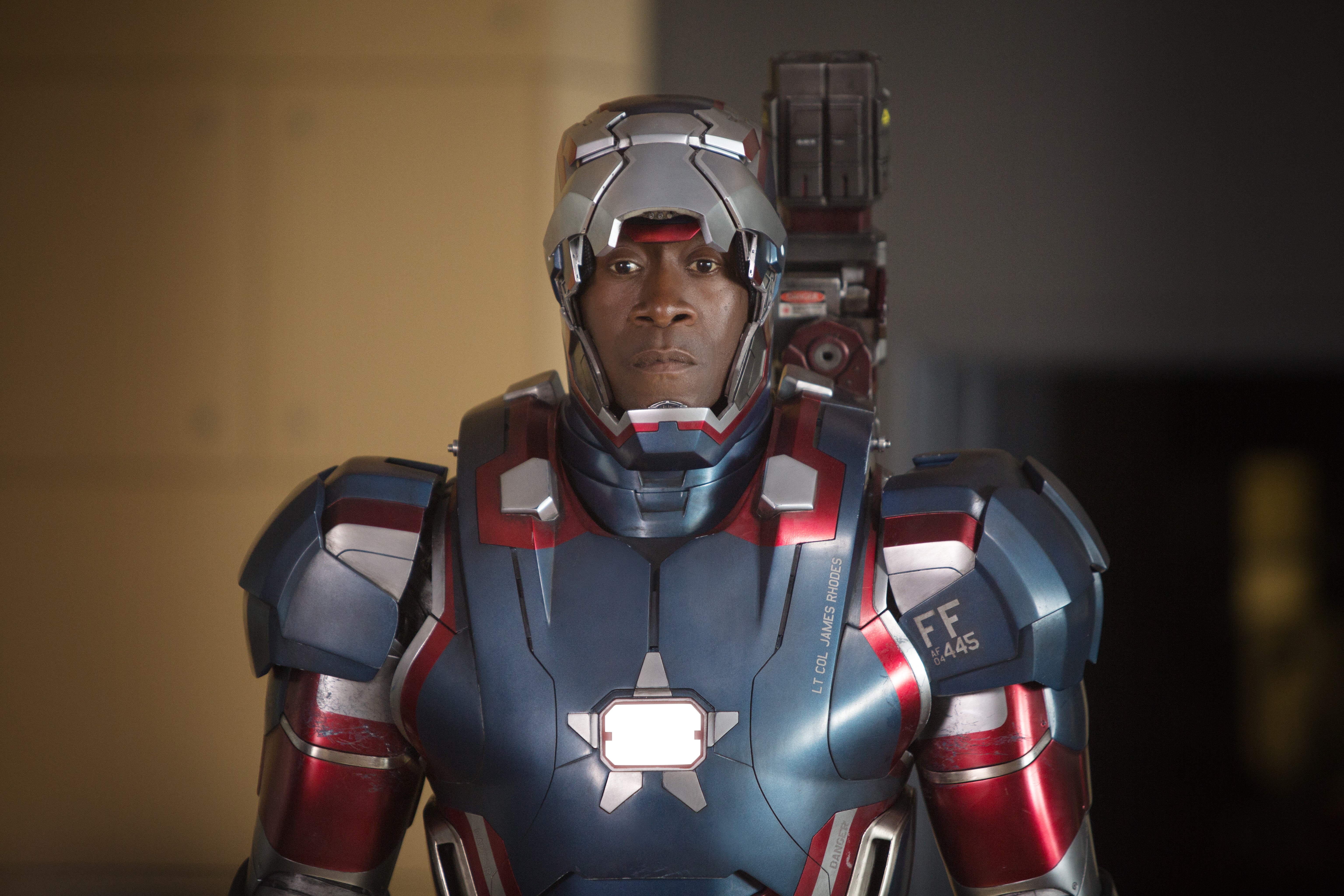 In Iron Man 2 War Machine has ED 445 FLTS on his shoulder. This is the  tail code for the 445th Flight Test Squadron out of Edwards Air Force Base,  which is