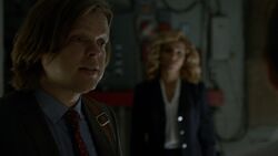 Nelson assisting  apply a hidden wire