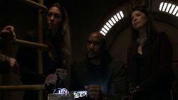 Mackenzie listens to a transmission