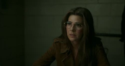 May is interrogated by  Agent 