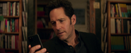 Scott Lang looks at his phone