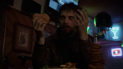  enjoys his meal in Mike's Beer