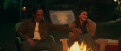 Taloa and  sitting by the campfire