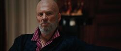 Obadiah-Stane-watches-the-news