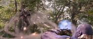 War Machine firing at Thanos