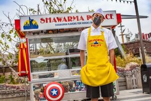 A franchise of the restaurant the Avengers visited after the Battle of New York, Shawarma Palace serves a selection of shawarmas to veteran super heroes and new recruits.[6]