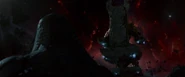 Thanos sitting on his throne.