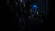 The Other giving Loki the Scepter.
