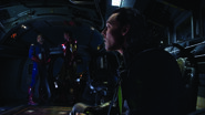 Steve and Tony escorting Loki back to S.H.I.E.L.D. aboard the Quinjet.