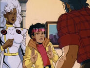 Ororo tries to calm an agitated Logan down with Jubilee.