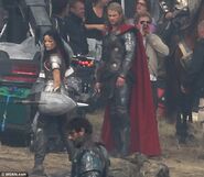 Jaimie Alexander and Chris Hemsworth on set as Sif and Thor.