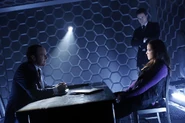 Skye being interrogated by Coulson and Ward.