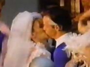 Sue kisses her new husband Reed Richards