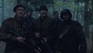 The Howling Commandos in a forest.