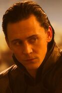 Loki looking at Sif and the Warriors Three.