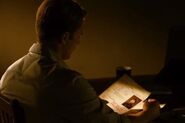 Steve Rogers reading Jim Morita's file.