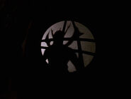 Asmodeus' silhouette through the Sanctum Sanctorum's window.