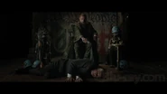 Mandarin holding Thomas Richards hostage at gunpoint.