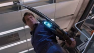 Bruce Banner holding the Chitauri Scepter.