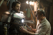 Tony donning his first armor with the assistance of Yinsen.