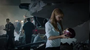 Pepper facing the destruction caused by Mandarin's attack.