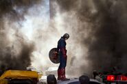 Captain America on the roof of a car.