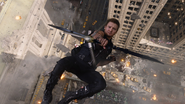 Hawkeye shoots an arrow while falling.