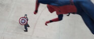 Spider-Man using his web-shooters to grab Cap's shield.