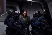 Loki escorted by S.H.I.E.L.D.