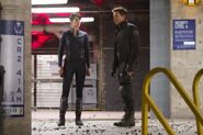 Maria Hill and Clint Barton on set