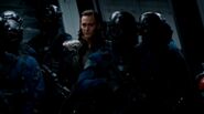 Loki being taken as a prisoner.