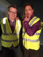 Robert Downey Jr. posing with producer Jeremy Latcham on set