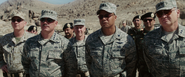 Rhodey stands with other Military officers watching the Jericho Missile demostration