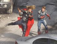 Chris Hemsworth and Chris Evans on set in costume.