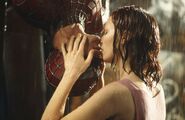 Spider-Man and Mary Jane share an upside down kiss.