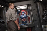 Steve looks at his uniform on display.