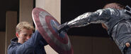 Bucky's metal arm colliding with Captain America's shield.