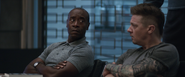 Rhodey and Barton listen to Thor