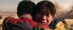 Ned Leeds hugs Peter Parker