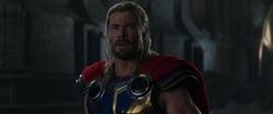 Thor sadly looks at Jane