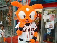 Giabbit posing in front of a baseball museum.